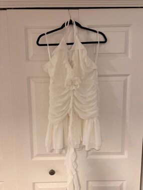 White Ruffled Mini Dress with Floral Accent